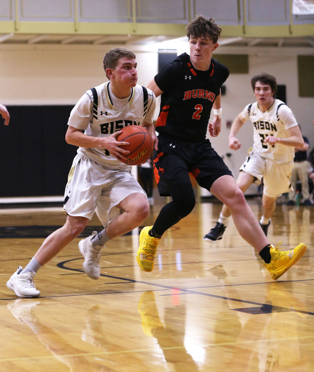 Taylor Swanston looks for a layup against Burns defender Caden David